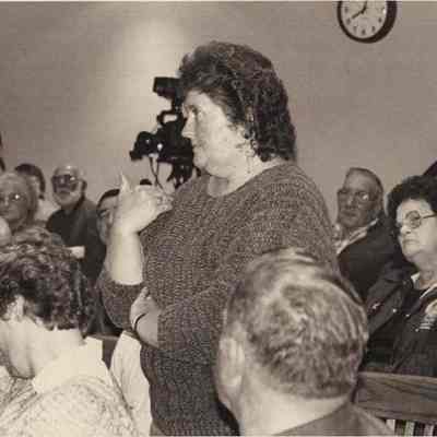 A photo view of a woman talking to a crowd. 9/23/1992.