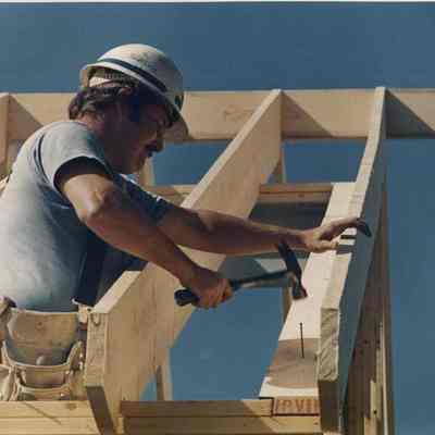 A photo view of a construction worker at work. 9/27/1988.
