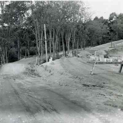 A photo of a washout on River Road. 9/12/1954.