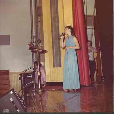 Phyllis opening the second half of the pageant and opening of gown presentation to "You Light Up My Life"