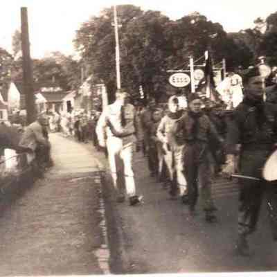A photo view of a parade about to cross the Frank J. Wood Bridge.