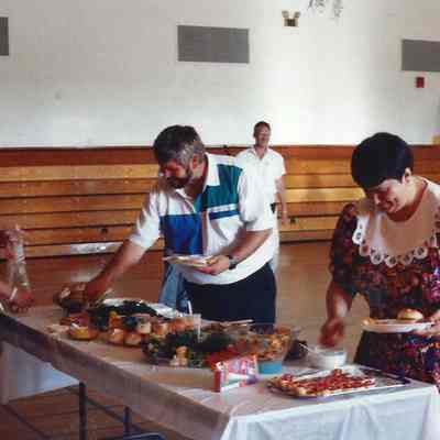 Linda and Ron Dodson getting food while Catherine Albano is also