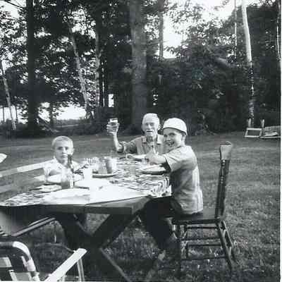 Samuel Holbrook and Two Boys at a Picnic Table