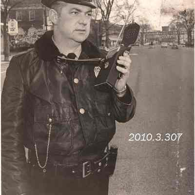 Patrolman William R. Medary Jr. Holding a New Radio