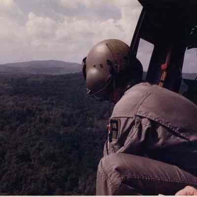 A photo view of people in a helicopter. 9/14/1990.