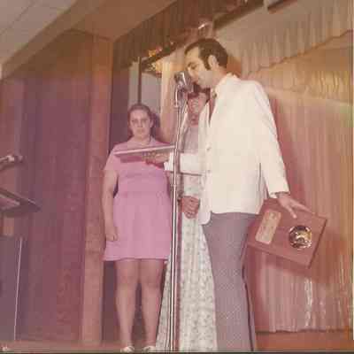 Gene Gagne reading the Pageant Award to the audiance