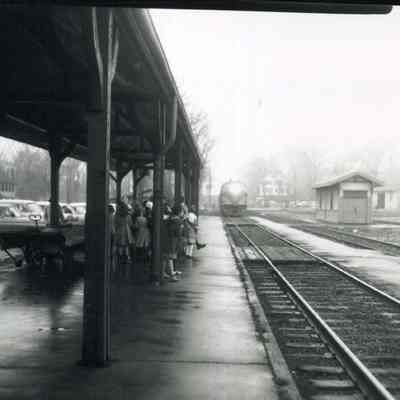 People waiting for train at railroad station