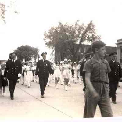 A photo view of people marching in a parade.