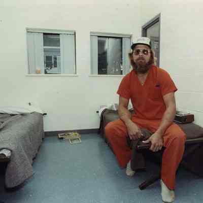 A photo view of a man sitting on a bunk. 10/18/1989.