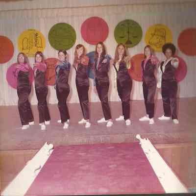 All the contestants in group line up.