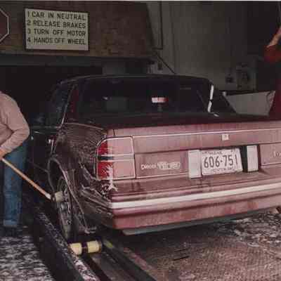 A photo view of a car in a car wash. 3/10/1987.