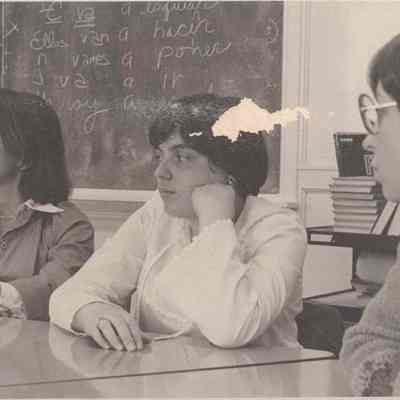 Three Women Sitting in a Classroom