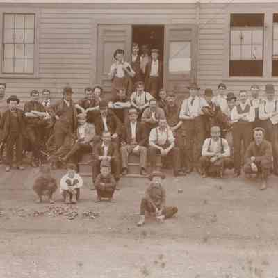 Men Outside a Mill Building