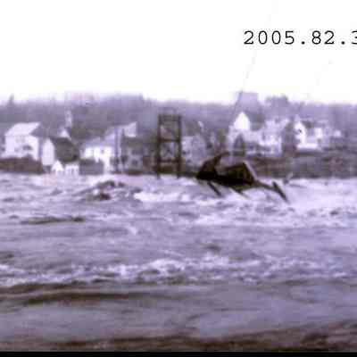 A photo of the Swinging Bridge across the Androscoggin River during the 1936 flood.
