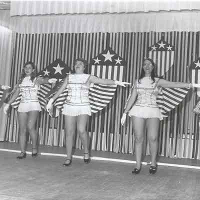 A B/W photograph of the contestants dancing