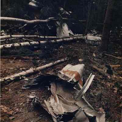 A photo view of wreckage in the woods. 8//7/1989.