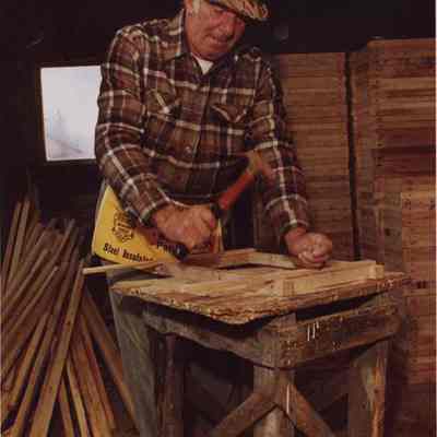 A photo view of a carpenter at work. 1//7/1988.