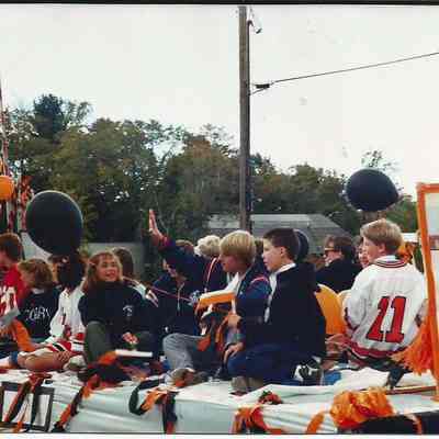 A color photograph of some kids riding a float in the 250th Anniversary Parade.