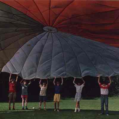 A photo view of a group of children holding ?. 6/22/1987.