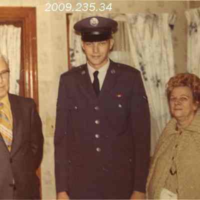 A photo of 3 unidentified people.