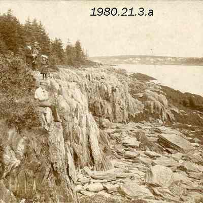 B/W photo of a family by the ocean.