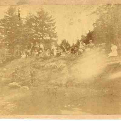 People on the shore at Wells' Cottage, Mere Point