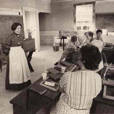 A photo view of a reenactor as a teacher at Growstown School. 8/27/1982.