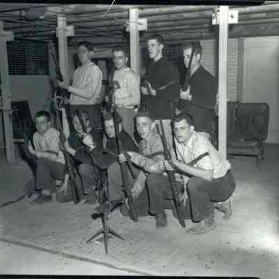 Young Men with Rifles at Rec. Center