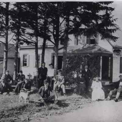 Unknown people in front of house