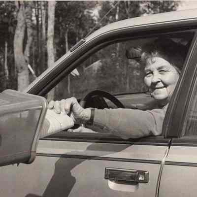 A photo view of a woman delivering newspapers. 10/9/1992