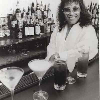 A photo view of a woman bar tender. 9/28/1992.