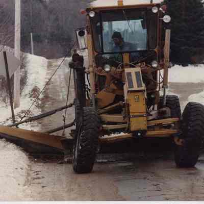 A photo view of a snow plow. 12/12/1989.