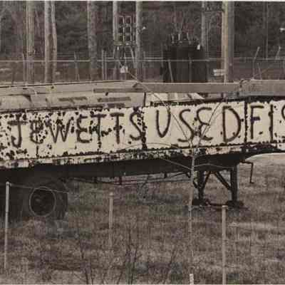 A photo view of a sign at Ernest Jewett's. 12/9/1976.