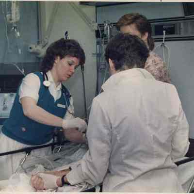 A photo view of a nurse at work. 5/1/1989.