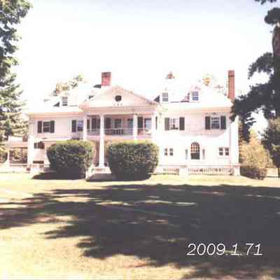 A photo of the house at the corner of Maine and College Streets.