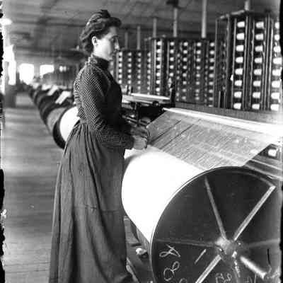 A woman at work in a factory.