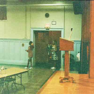 A color photograph of the nearly empty pageant hall.