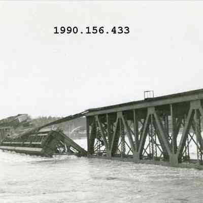 Railroad Bridge as it was being washed away during the Flood of 1936
