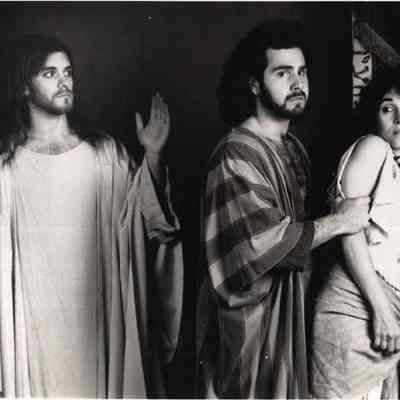 A photo view of three people. 7/7/1992.
