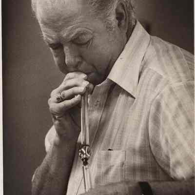 A photo view of Herbert Merrill blowing glass. 4/17/1978.