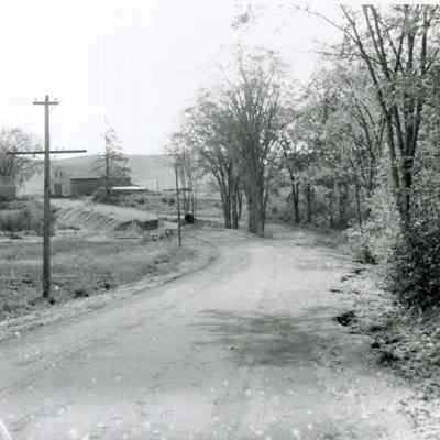 A photo of a washout on River Road. 9/12/1954.