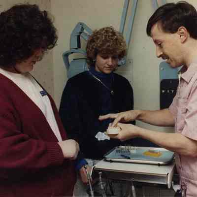 A photo view of a dentist. 11/27/1989.
