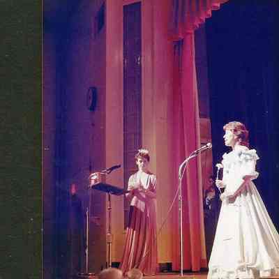 A color photograph of M. C. Sharon Hinckley asking Wendy Mercier the question.