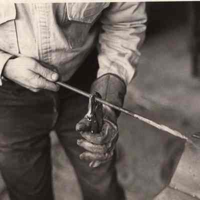 A photo view of Jim Bennis bending some iron. 2/7/1992.