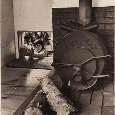 A photo view of a wood stove. 3/9/1981