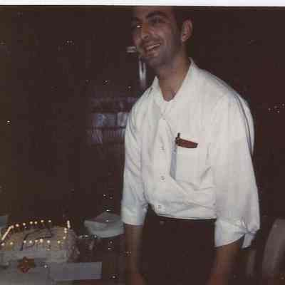 A B/W Polaroid photograph of an unknown man.