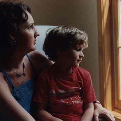 A photo view of a woman and a child. 7/28/1989.