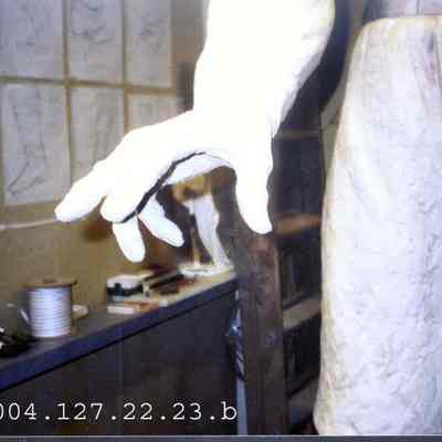 A color photo of the hand on the JLC statue.