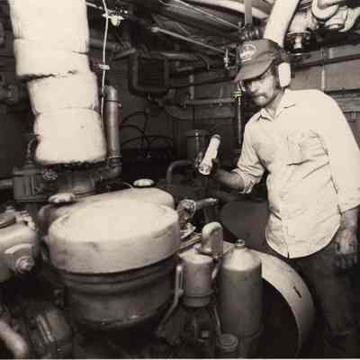 A photo view of a workman on board a ship. 5/29/1992.