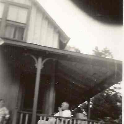 Unknown Man and Woman Sitting on a Porch